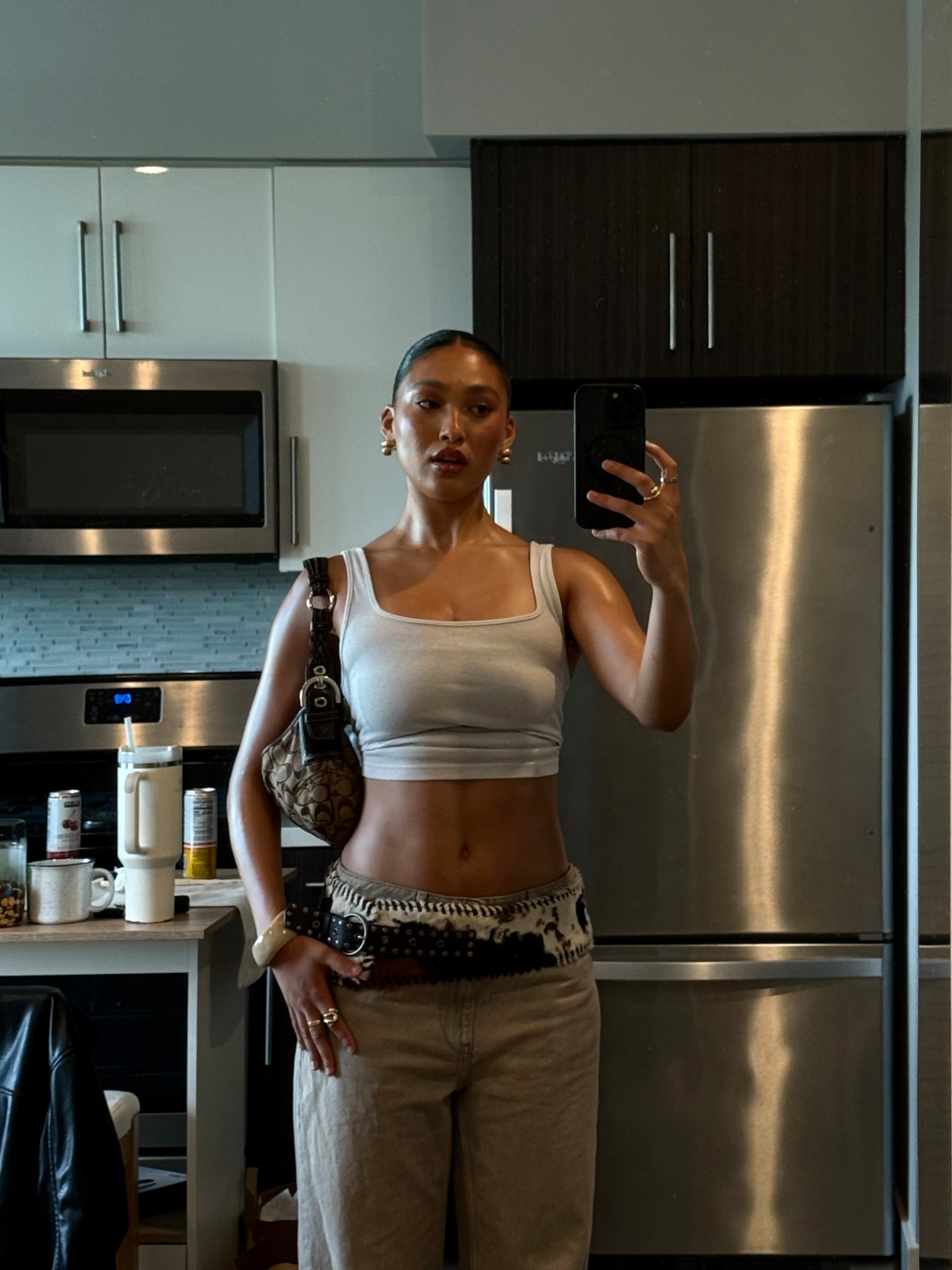 summer y2k inspired simple girls night outfit, white cropped tank, zara jeans, jaded london cow print belt, vintage coach bag, and black kitten heels 

#LTKBeauty #LTKStyleTip #LTKSummerEdit