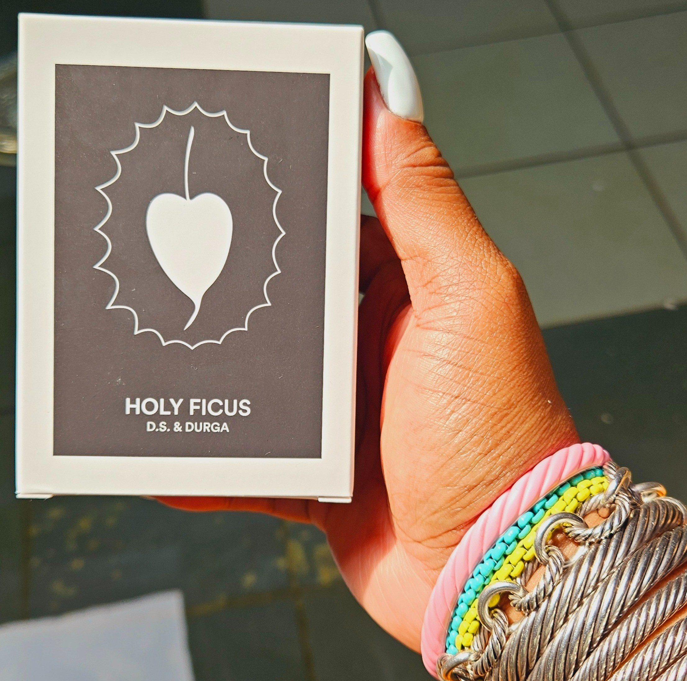 DS and Durga Holy Ficus Candle - TOP NOTES - cardamom frankincense. HEART NOTES - fig cedar. BASE NOTES - ginger root saffron. & David Yurman arm candy 

