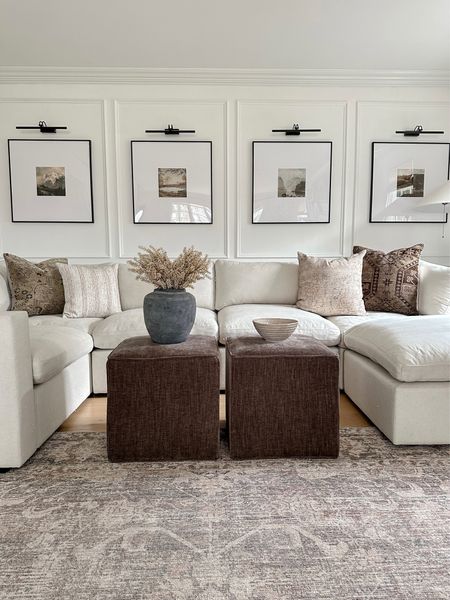 Neutral home living room seating and decor. The perfect brown ottoman cubes, decorative brown bowl, sectional sofa, area, rug, oversize gallery, frames battery operated picture, lights, throw pillows.

#LTKsalealert #LTKhome #LTKfamily