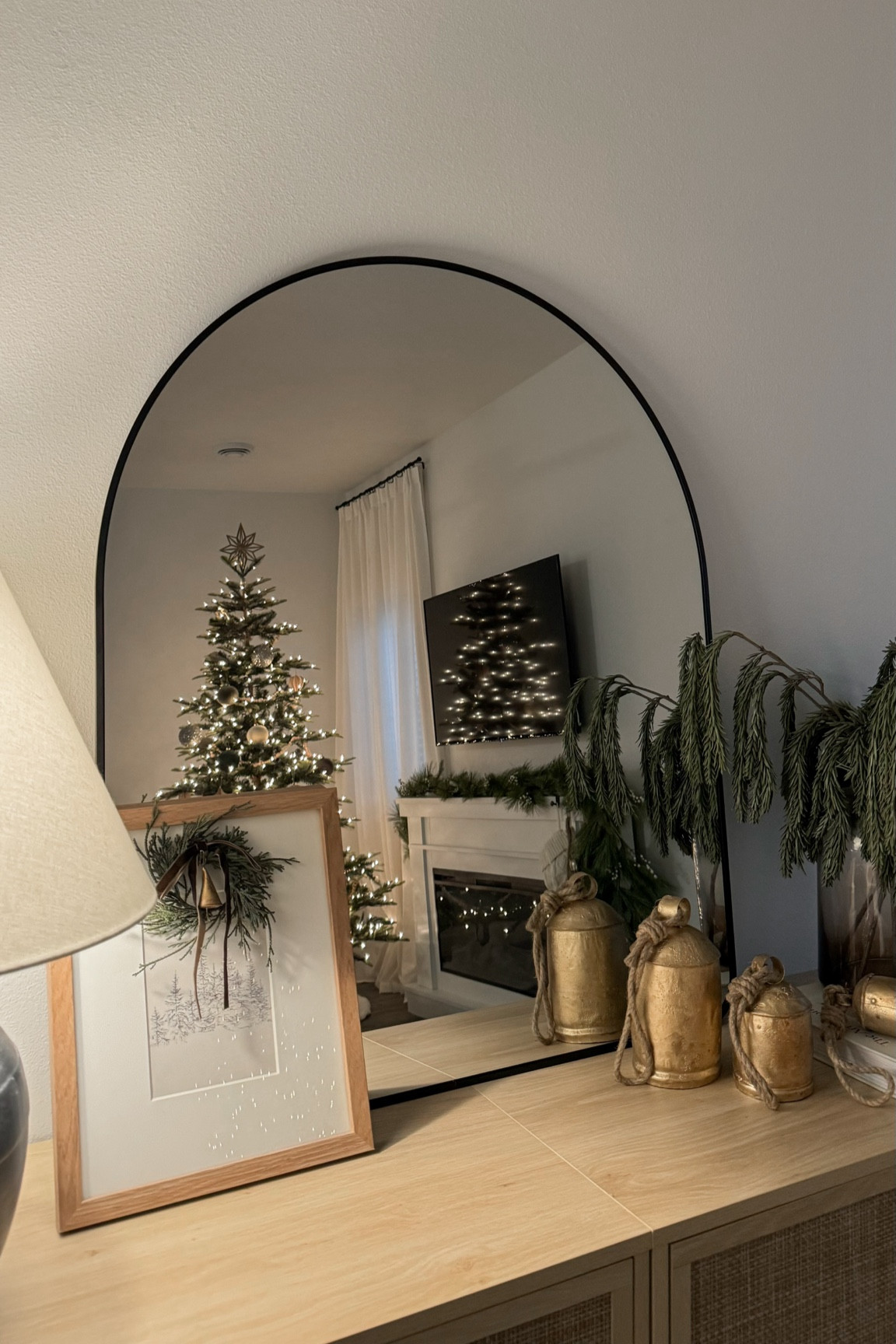 Simple holiday console table styling! Loving my new arched mirror from Amazon 😍

#LTKSeasonal #LTKHome #LTKCyberWeek
