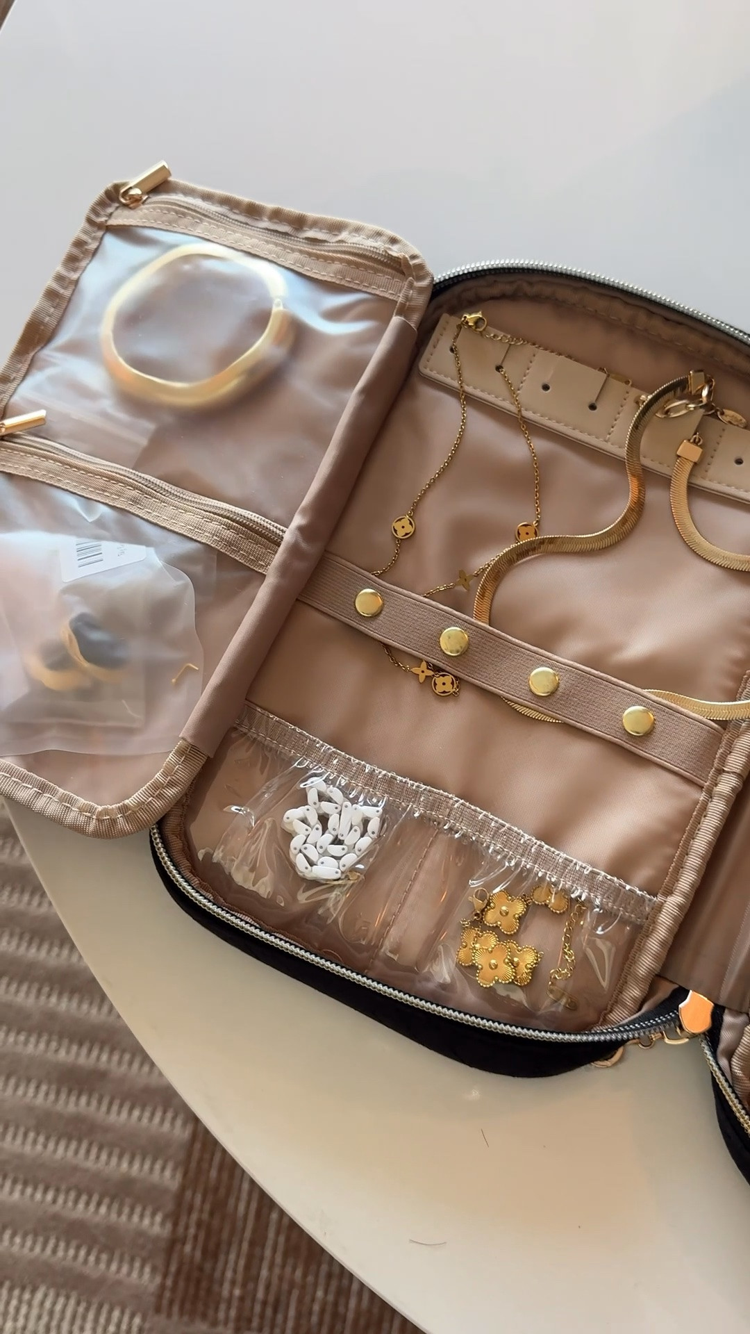 How I pack my jewelry when traveling. It holds so much with compartments for earrings, necklaces, rings, bracelets and even larger items like bows. Keeps everything in one place and zips closed for easy storage. 

#travelessentials #mothersdaygift #packinghack #travel

#LTKMothersDay #LTKTravel #LTKWorkwear