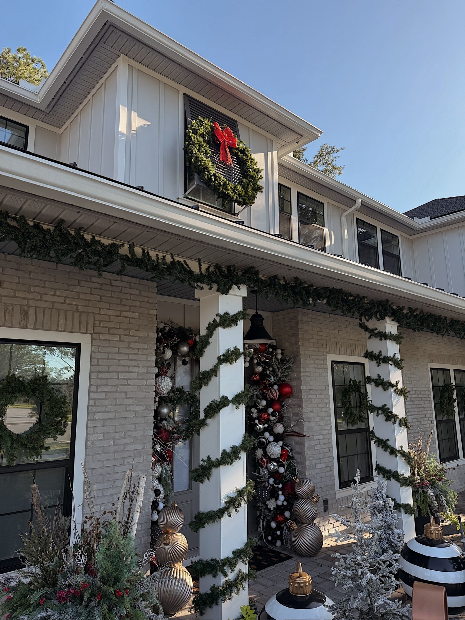 Our Christmas front porch! Lots of garland, wreaths and festive planters!

#LTKSeasonal #LTKHome #LTKHoliday