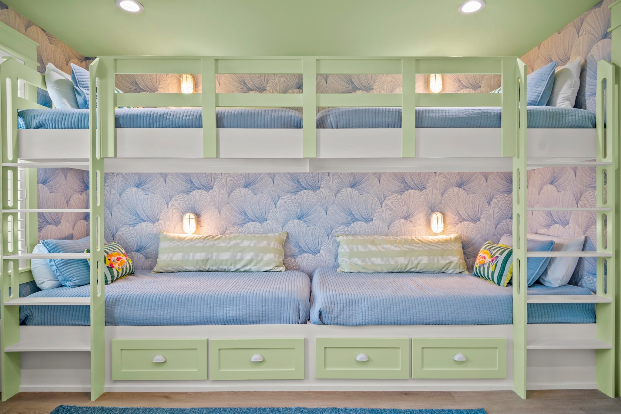 Bunk room dreams do come true ✨
This custom coastal bunk setup is built for memory-making — with soft seafoam greens, wave-inspired wallpaper, and cozy lighting for each bed. Perfect for sleepovers, siblings, or sandy little feet after a day at the beach. 🌊💤

Design tip: Built-in drawers keep things tidy, even with a full house!

#BunkRoom #InteriorDesign 