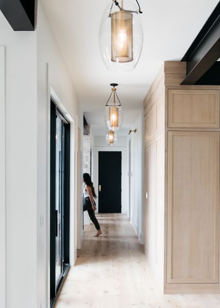 We absolutely love the Dunbar pendant from Savoy House. There are 8 of them that go down this hallway.

#LTKStyleTip #LTKHome