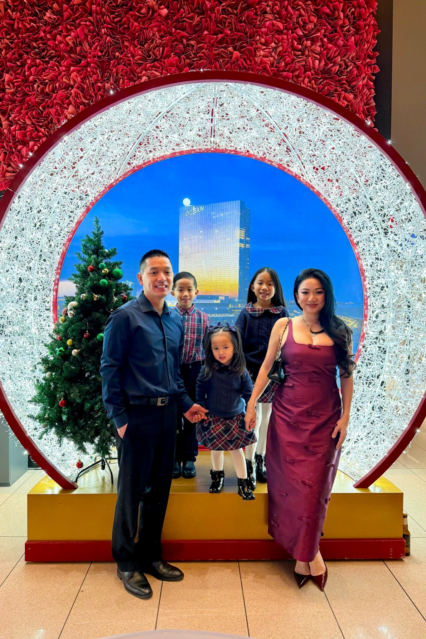 Royal Blue Christmas Matching Family // Blue and maroon plaid outfits for the kids. The girls wore a blue cable knit sweater with a bow and plaid collar with a matching tiered ruffle skirt. My son wore a plaid poplin button up shirt and blue velvet dress pants. On me is a Lovaan Camilla burgundy bow embellished midi dress.

#LTKHoliday #LTKSaleAlert #LTKKids