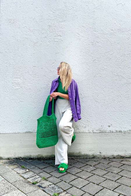 Purple Shacket. Fashion Blogger Girl by Style Blog Heartfelt Hunt. Girl with blond hair wearing a purple shacket, green top, slim sunglasses, green straw bag, wide leg pants and green chunky sandals. #colorfuldenim #widelegpants #colorfuloutfit #colorfulstyle #colorfulfashion #colorfullooks #fashionfun #cutesummeroutfit #summerfashion2023 #summerlookbook #fitcheck #dailylooks #dailylookbook #contentcreator #microinfluencer #discoverunder20k
