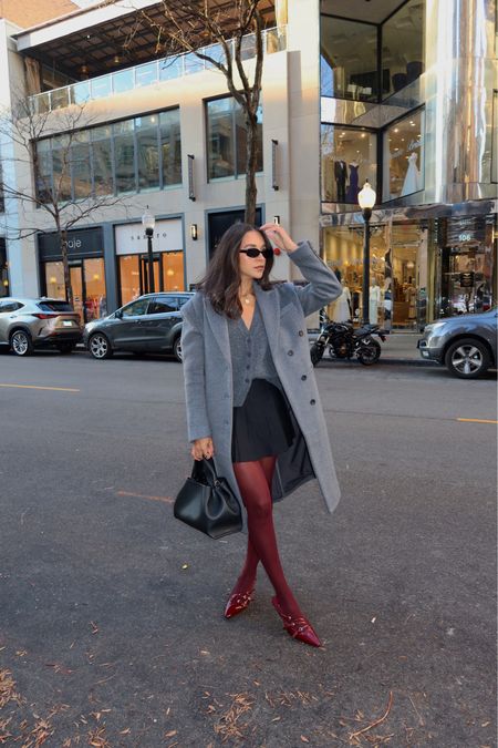grey coat, grey sweater vest, grey outfit with burgundy shoes and tights, cherry red shoes, cherry red tights, burgundy tights, polene bag, 