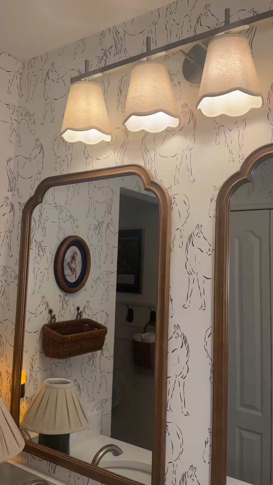 A horse-themed bathroom she can grow into 🐎🤎

Ella loves horses, so I started with horse-print wallpaper and added warm wood mirrors, scalloped lighting, and little equestrian details. It’s still our builder-grade bathroom—just a lot more her.

If you’re decorating around something your child loves, you don’t need every piece to match the theme. A few personal touches mixed with classic pieces can pull it all together.

Here’s where everything is from:

• Wallpaper: Love vs. Design
• Light, mirrors, wall basket, rug & shower curtain: Amazon
• Towel hook & horse jar: Anthropologie
• Tray & horse statue: World Market
• Cabinet hardware: Asidrama (gifted)
• Lamp: Target

Comment BATHROOM for the links!

#LTKHome #LTKKids #LTKvlog