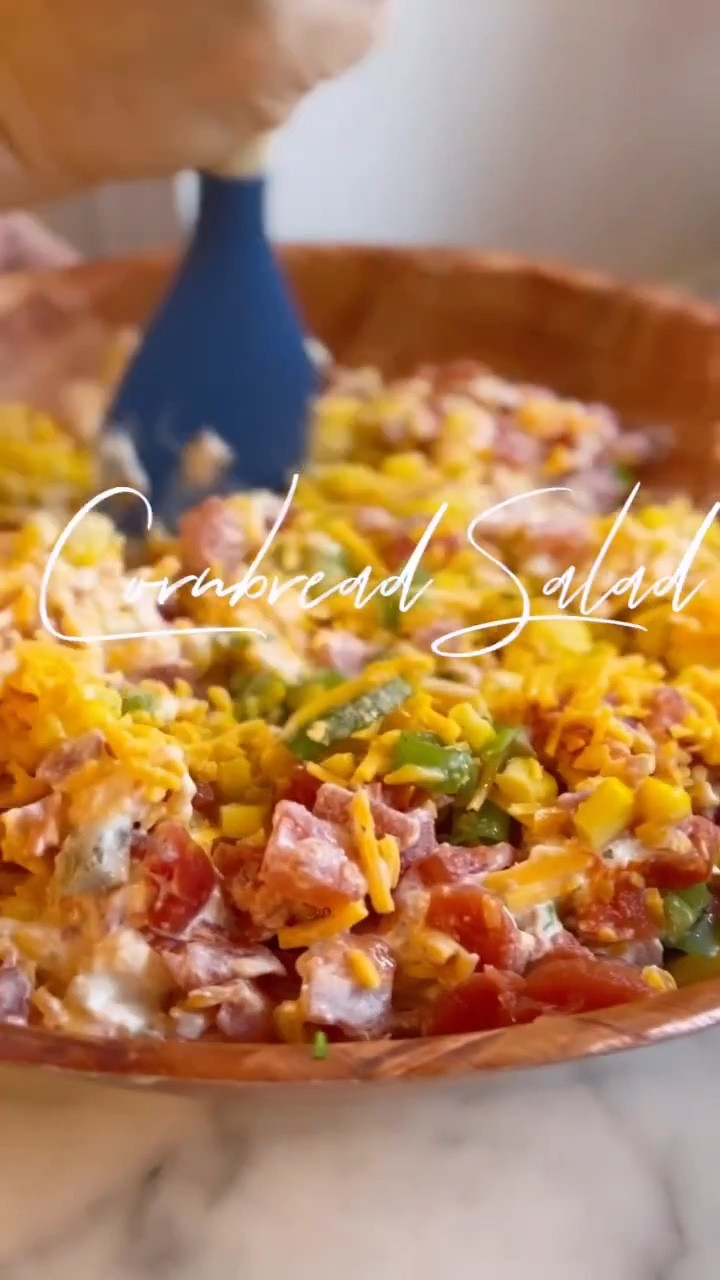 Cornbread Salad
2 cans of drained whole kernel corn 
2 cans of drained rotel 
1 bag of sharp cheddar cheese 
1 cup of chopped green scallions (onions if you prefer) 
1 package of Hidden Valley Ranch seasoning 
1 cup of Duke’s mayonnaise 
Mix all together
1 9x9 pan of sweet cornbread crumbled 
Add cornbread just before you are ready to serve

I mixed and served this all in my wooden bowl from my dear friend @jennyreimold. So easy and minimum clean up necessary 👌