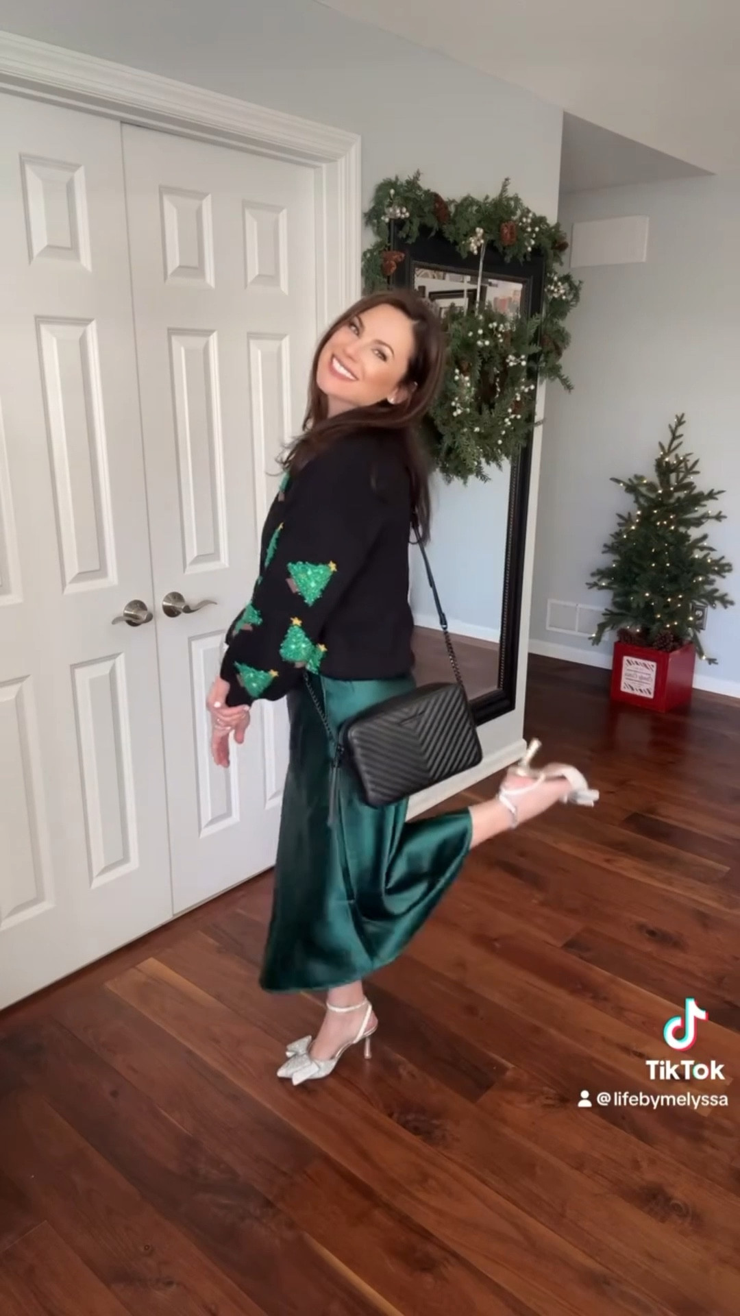 Looking for a holiday outfit that’s equal parts chic and festive? This trendy green slip skirt is giving all the holiday glam vibes, especially when paired with sparkly shoes and a Aldo purse! ✨ But the star of this look? The cutest Christmas Tree 🎄 sweater that adds a touch of playful charm while keeping it comfy for busy moms!
Also, including additional Christmas outfits and holiday outfits.

#LTKPetite #LTKOver40 #LTKHoliday
