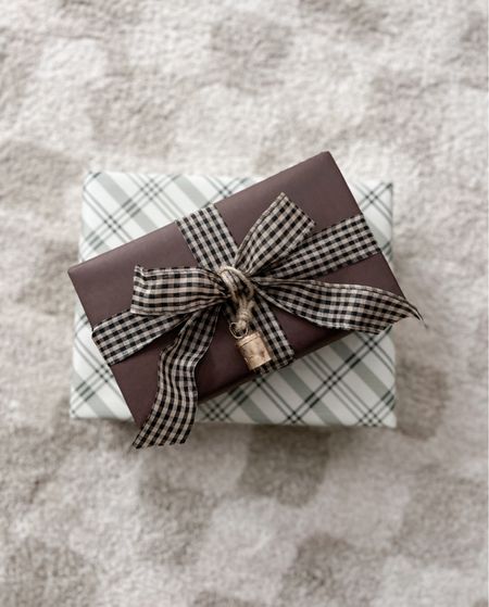 The prettiest Christmas wrapping paper combo - loving the brown mixed with the plaid and gingham. I add these cute little bells for an extra special touch! 

#LTKHoliday #LTKfindsunder50 #LTKSeasonal