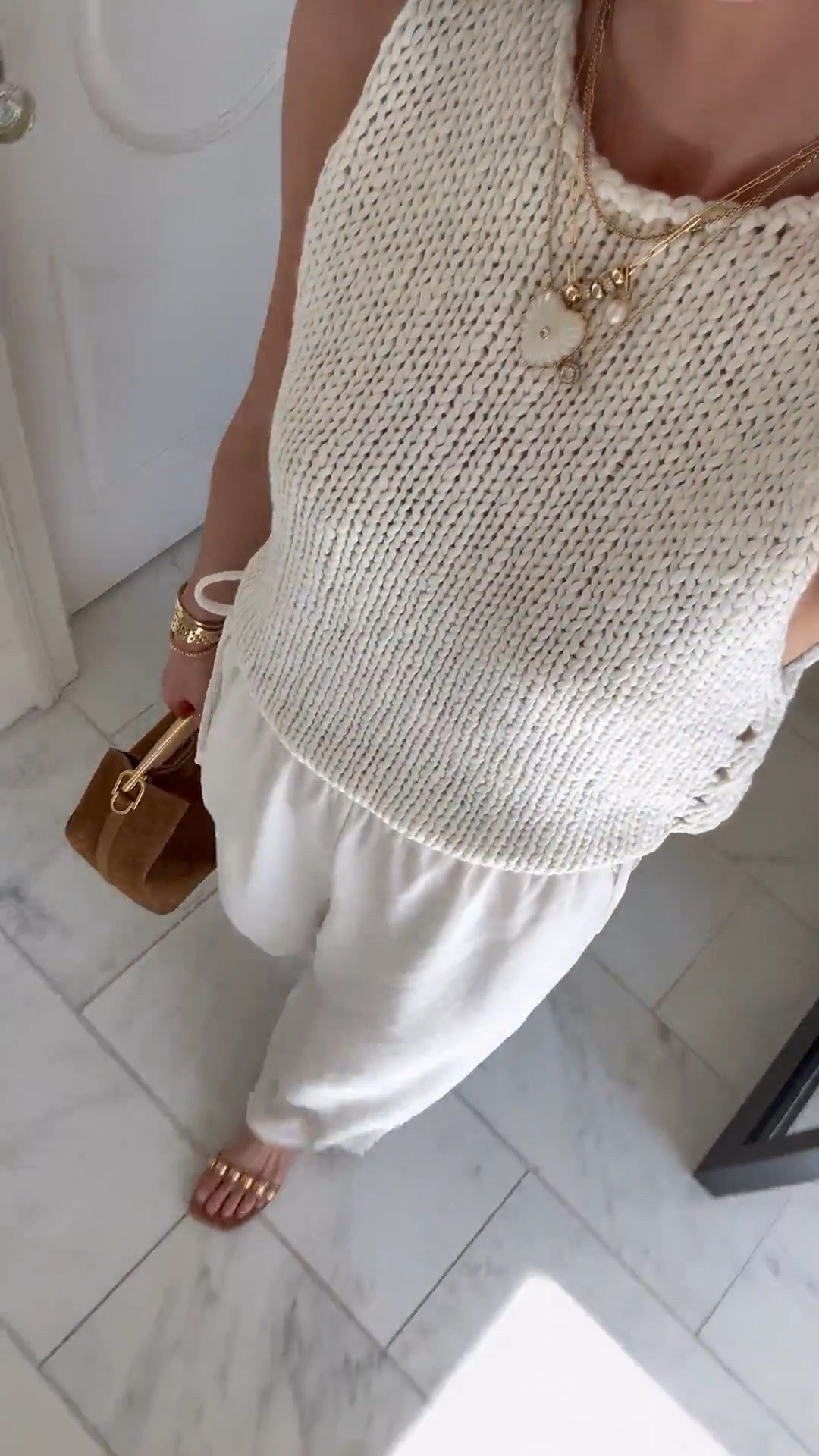 Love this sleeveless summer sweater - paired with the viral @Aritzia pants that fit true to size.

#LTKsummer #LTKstyletip