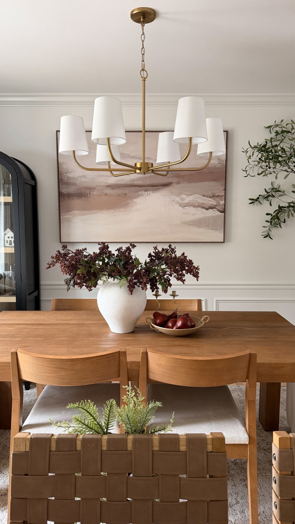Neutral winter dining vibes 😍🤎
Keeping this space cozy and elevated with warm woods, soft textures, and a few simple seasonal touches that feel calm — not cluttered.

I linked the chandelier, dining table, vase, stems, artwork, and chairs if you’re building a similar look in your home 🫶



#LTKHome #LTKSaleAlert #LTKHoliday