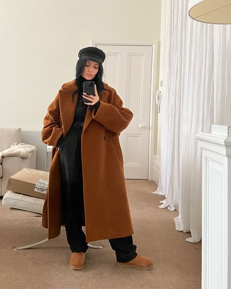 Donna Bartoli of donnabartoli.com wears a chic winter outfit. Oversize wool coat, tapered black trousers, long sleeve wool knit top, ultra mini ugg boots and nautical cap. Exact coat is sold out but similar listed (go for two sizes bigger to ‘get the look’) Ugg boots also sold out

#LTKSeasonal #LTKeurope #LTKfit