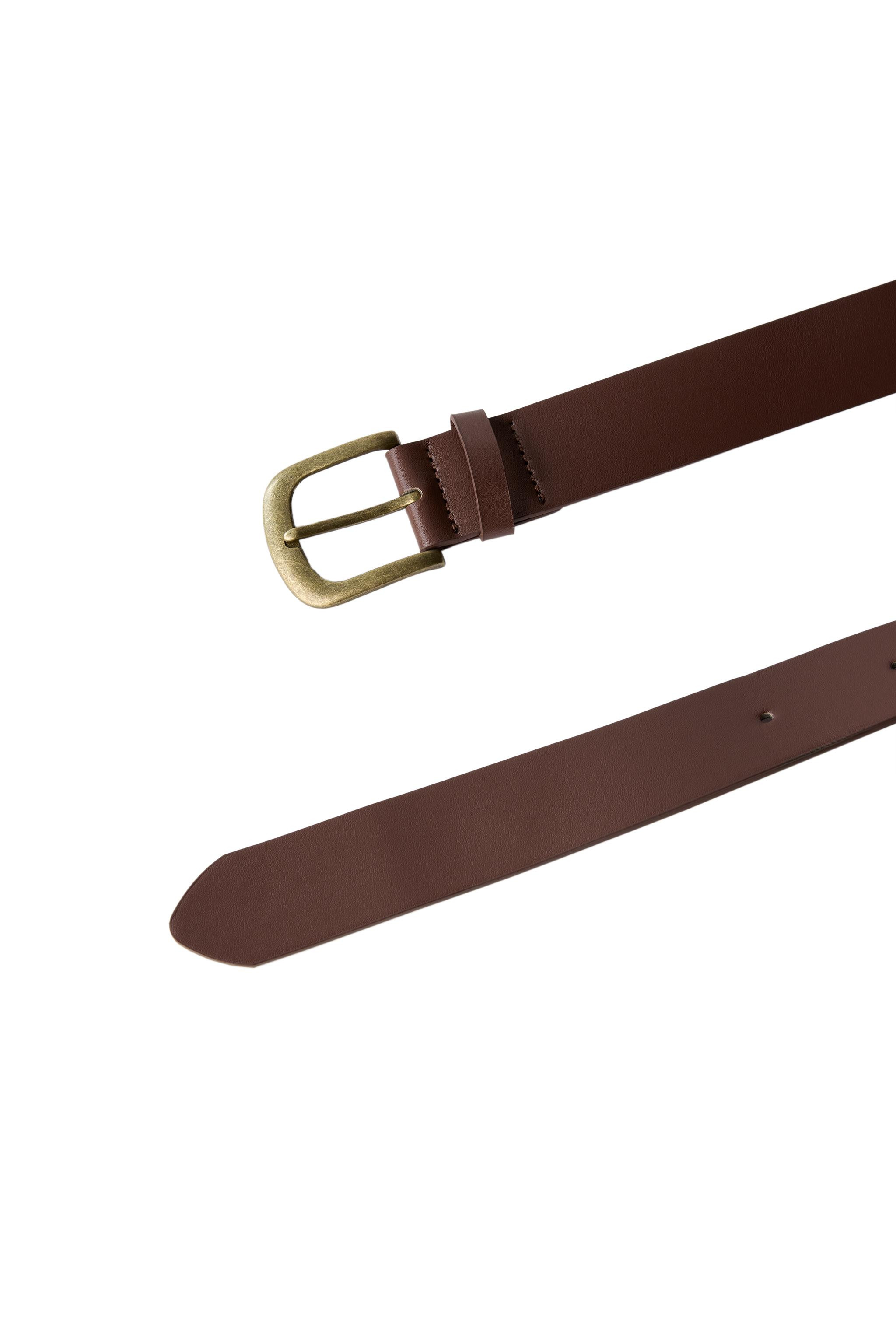Faux leather belt. Buckle and loop closure. | Zara US