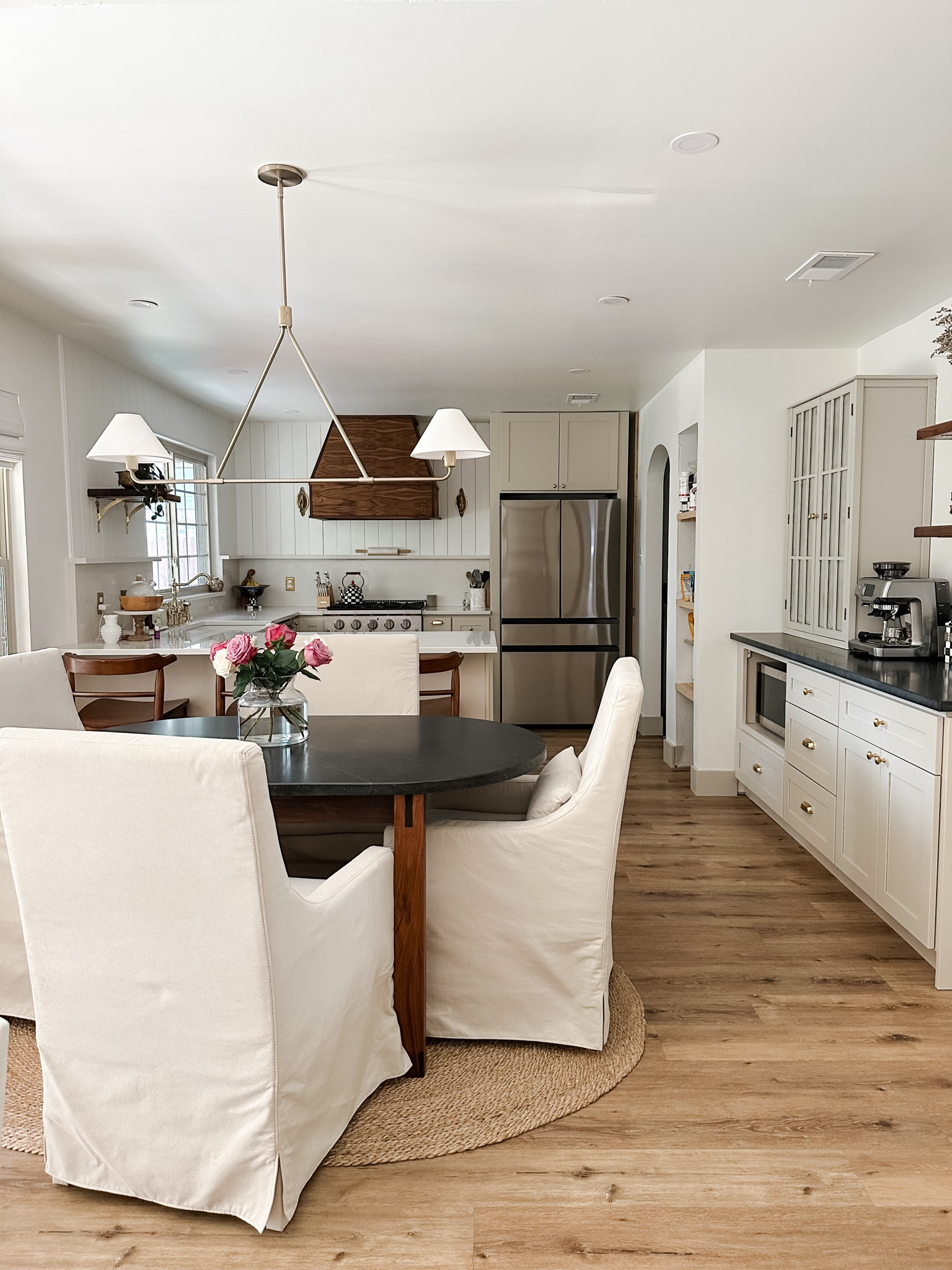 We absolutely love this light fixture thag we found for above our dining room table. It is the perfect design element without obstructing the view of the walnut vent hood in the kitchen. 

Bonus: it’s affordable. 

#LTKhome