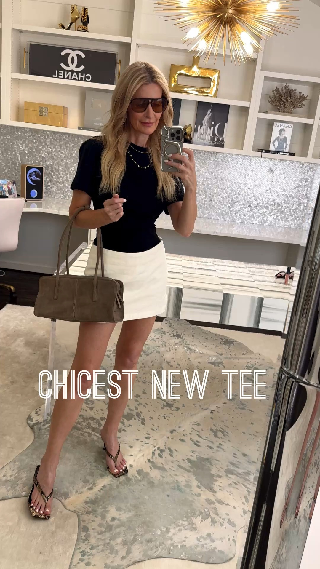 Obsessed with this $54 tee 🖤

This black tee is my new favorite — it’s fitted at the waist, so it actually creates shape instead of just hanging there, which instantly makes it look more elevated than your typical basic tee. The material is genuinely so good — you’d guess this cost three times what it actually did.

I paired it with this ivory denim skirt and these snake print kitten heels for an easy, stylish casual look that still feels put-together.

Both the tee and the skirt run true to size — I’m wearing an XS in each.

#LTKootd #LTKgrwm #LTKOver40