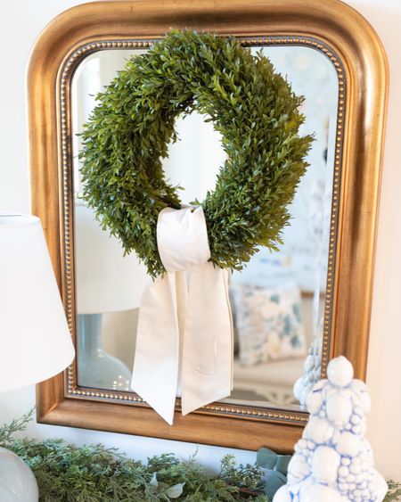 Holiday wreath on a gold mirror for the Holidays! #boxwoodwreath #wreathsash #holidays #wreaths #figanddove #christmasdecor #traditionalhome 

#LTKSeasonal #LTKHoliday #LTKhome
