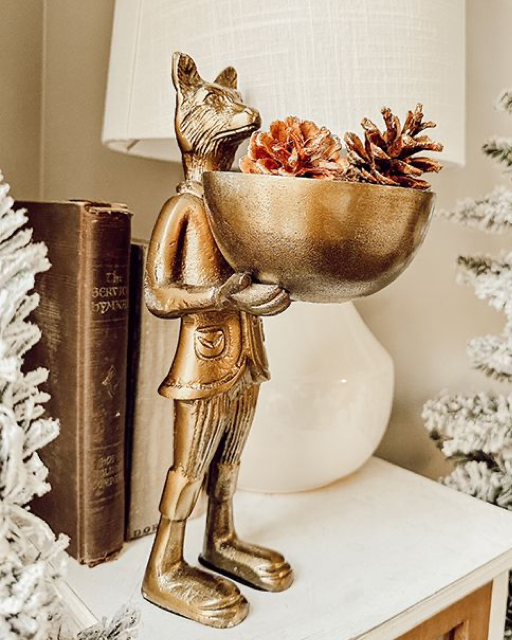 This charming fox with display bowl is the perfect touch of autumn, but also a whimsical woodland display throughout the year. It features a brass-gold finish and holds a bowl that can be used to display fitting decorative accent pieces suitable for each holiday.

#LTKSeasonal #LTKHome