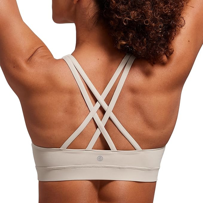 CRZ YOGA Naked Feeling Strappy Padded Sports Bras for Women - Fitness Workout Top Criss Cross Bac... | Amazon (US)