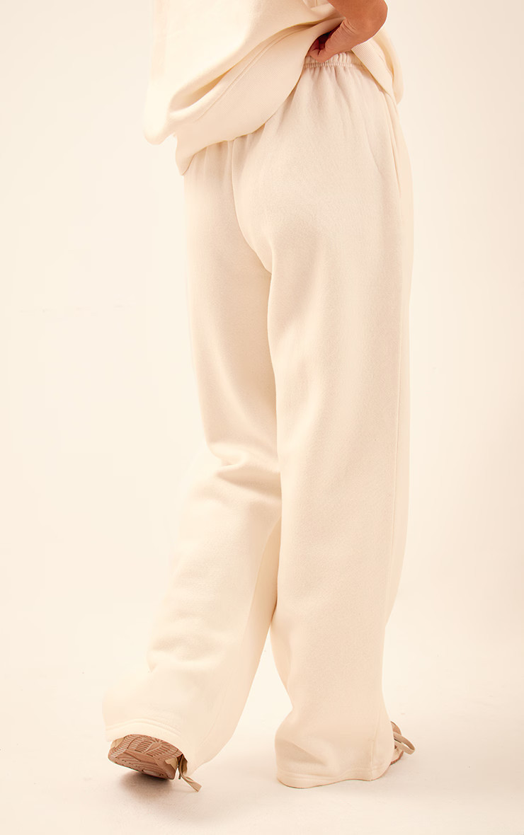 PRETTYLITTLETHING Cream Badge Detail Mid Rise Wide Leg Joggers | PrettyLittleThing UK