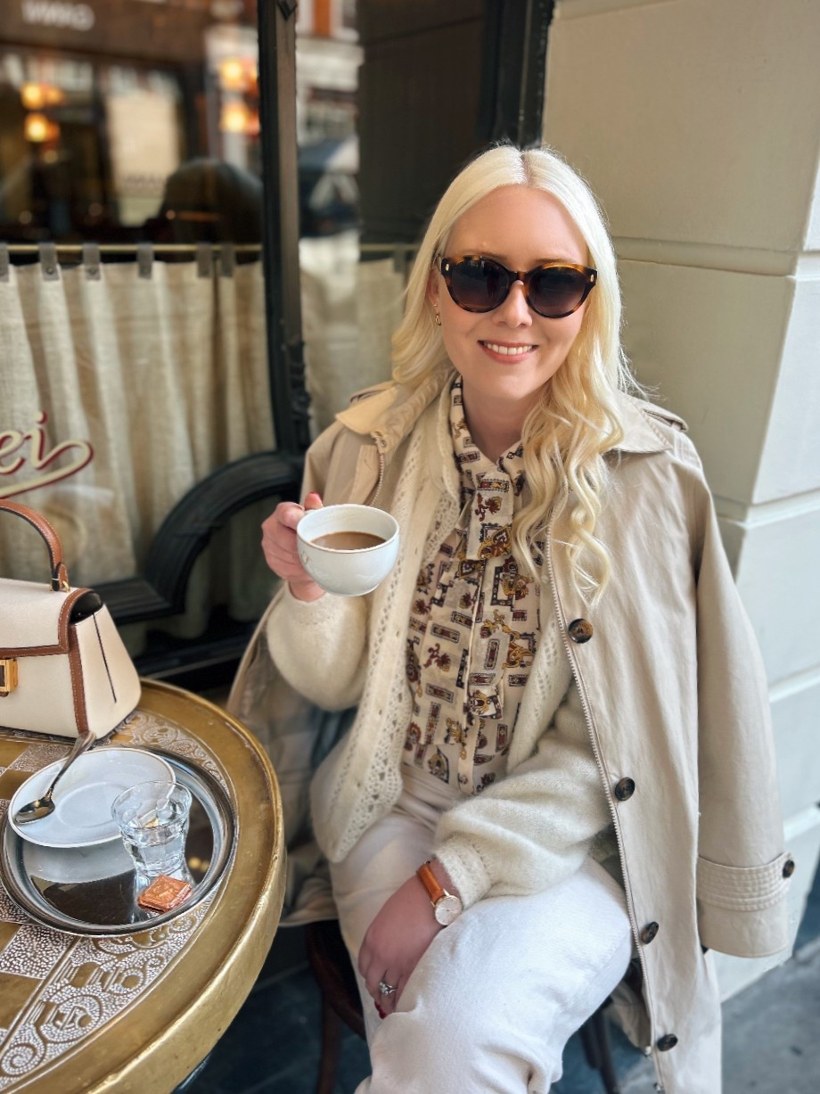 Cafe culture is well and truly in full swing thanks to spring sunshine we hope will be never-ending! 

I partnered my new Kate Spade ‘Katy’ top handle bag in cream & tan leather (with tan leather crossbody strap) from Brand Alley with a Claudie Pierlot blouse also bought from Brand Alley a few years ago (see product list for similar style). 

Also wearing the Angie fluffy Ecru / cream cardigan and Manu Trousers in Mottled Ecru, both from Sezane Paris. 

You’ll also spot my trusty Barbour single breasted stone coloured trench coat with finishing touches including Dower and Hall gold hammered hoop earrings and Orissa small gold white topaz stud earrings, plus tortoiseshell sunglasses by Ralph Lauren and two tone tan and raffia Mary Janes by Boden. 

#LTKuk #LTKeurope #LTKspring