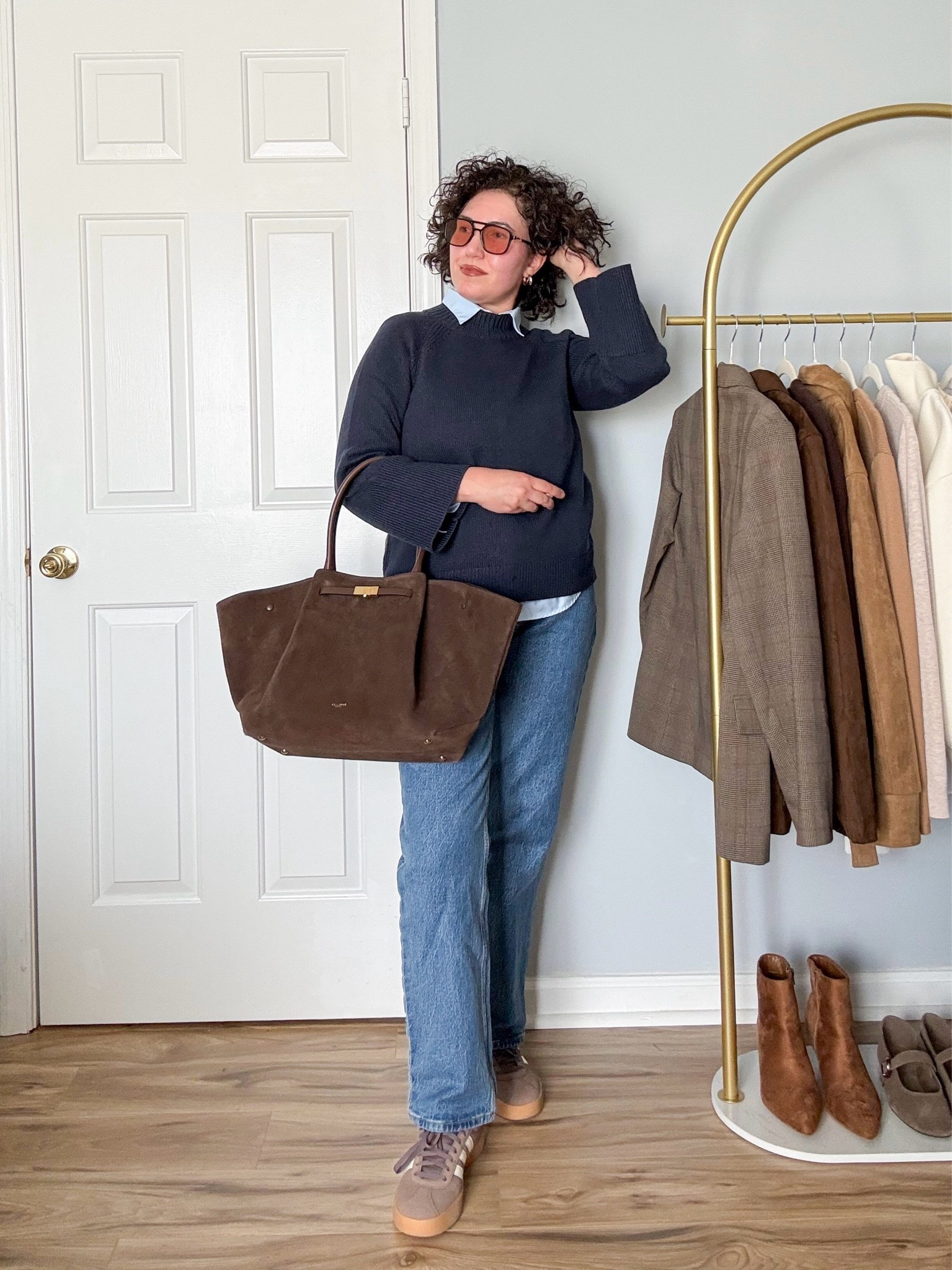 Casual fall outfit, navy sweater, jeans, brown sneakers, brown bag

#LTKOver40 #LTKgrwm #LTKootd