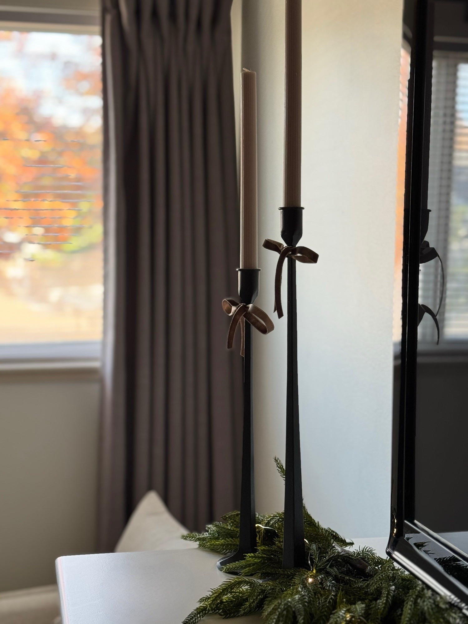 Norfolk pine, candlesticks, iron taper 

#LTKHome #LTKHoliday #LTKSeasonal