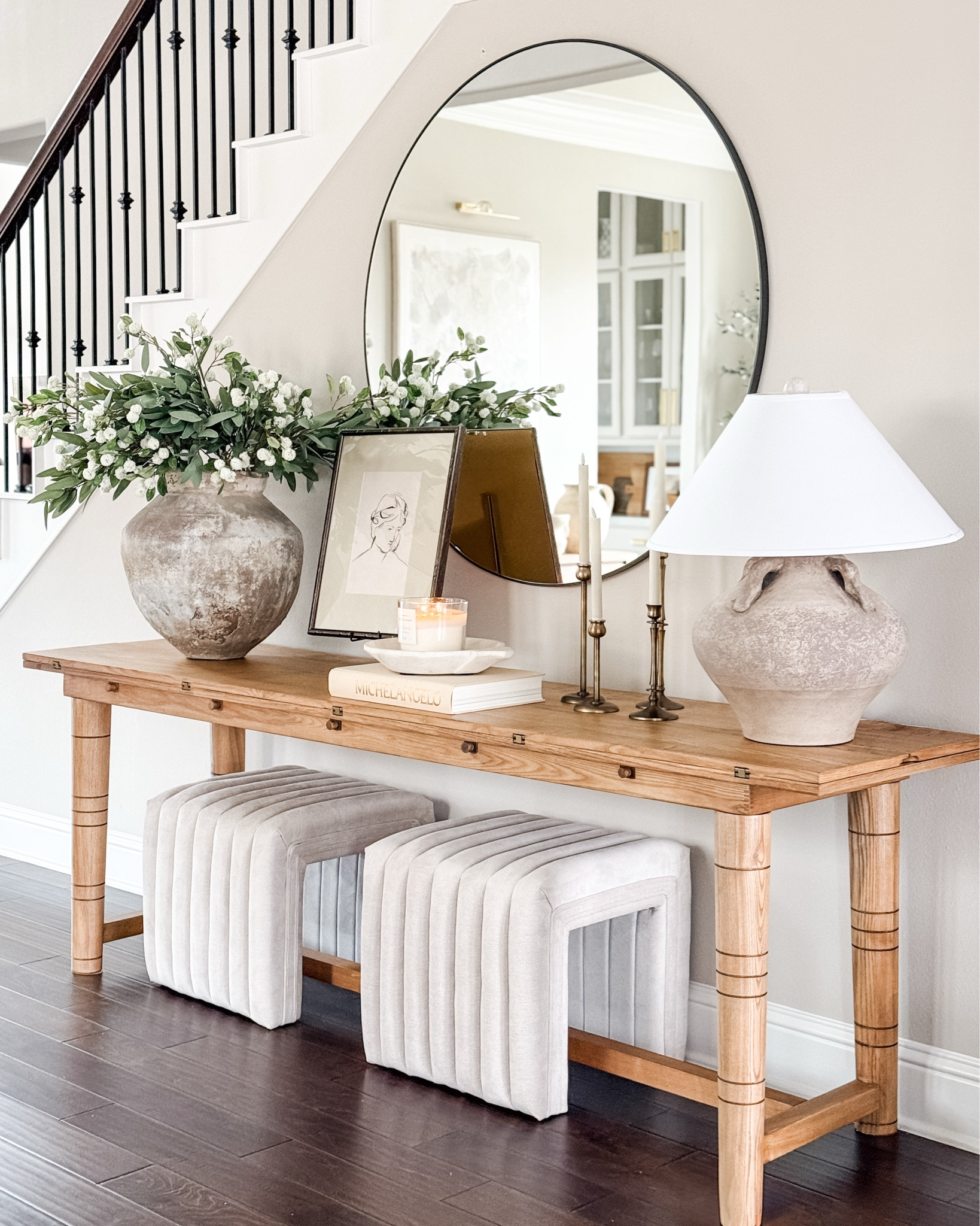 Spring Entryway look! Mt mirror is 48” Round. New spring stems / florals from Amazon, my new target candle from my haul, my best selling ottomans. The complete entryway look is linked here! 

#LTKSeasonal #LTKHome #LTKFindsUnder100