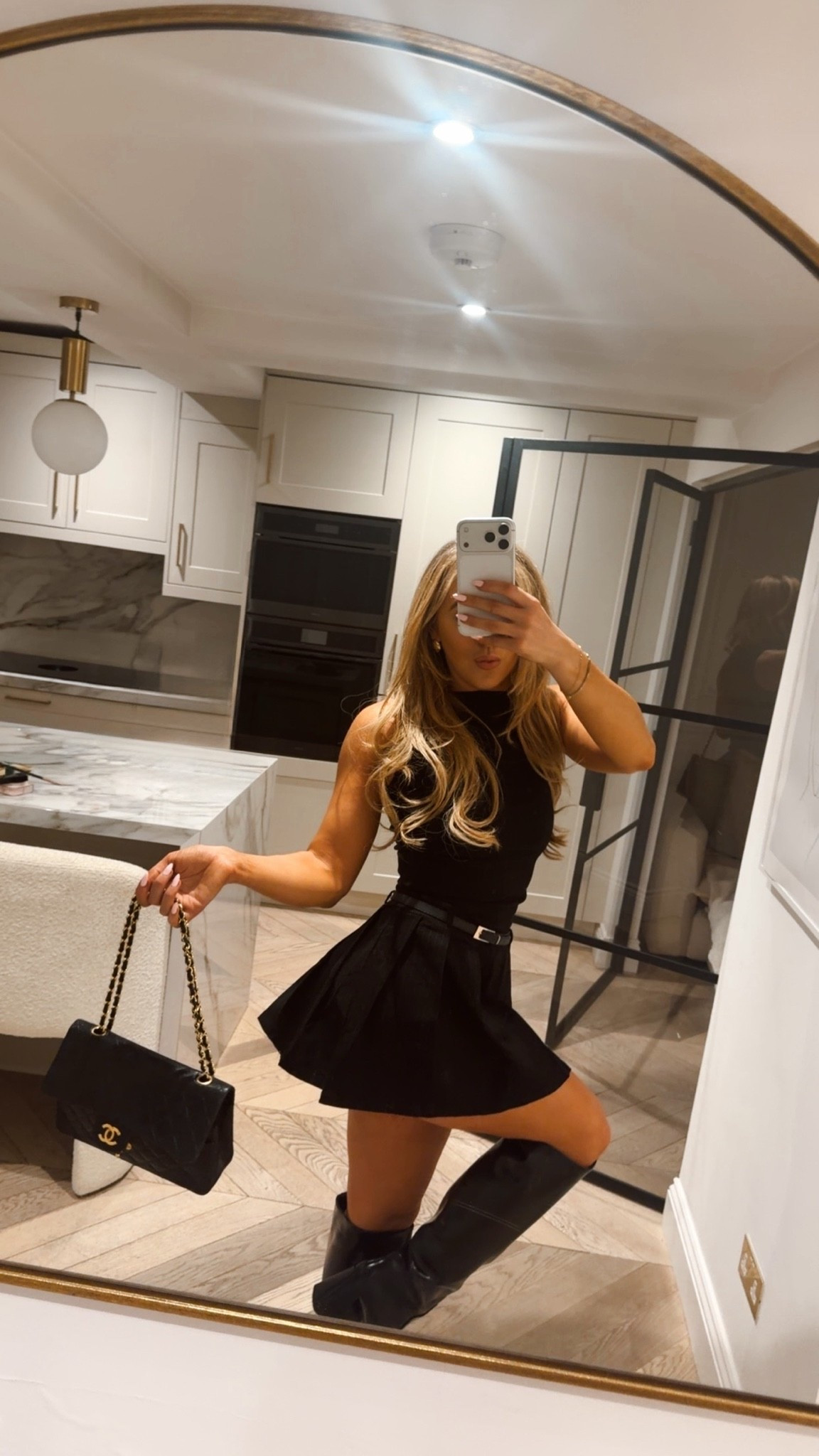 Knee high boots - leather boots - winter boots - Chanel bag - pleated dress - tailored dress - mini dress - lbd - little black dress