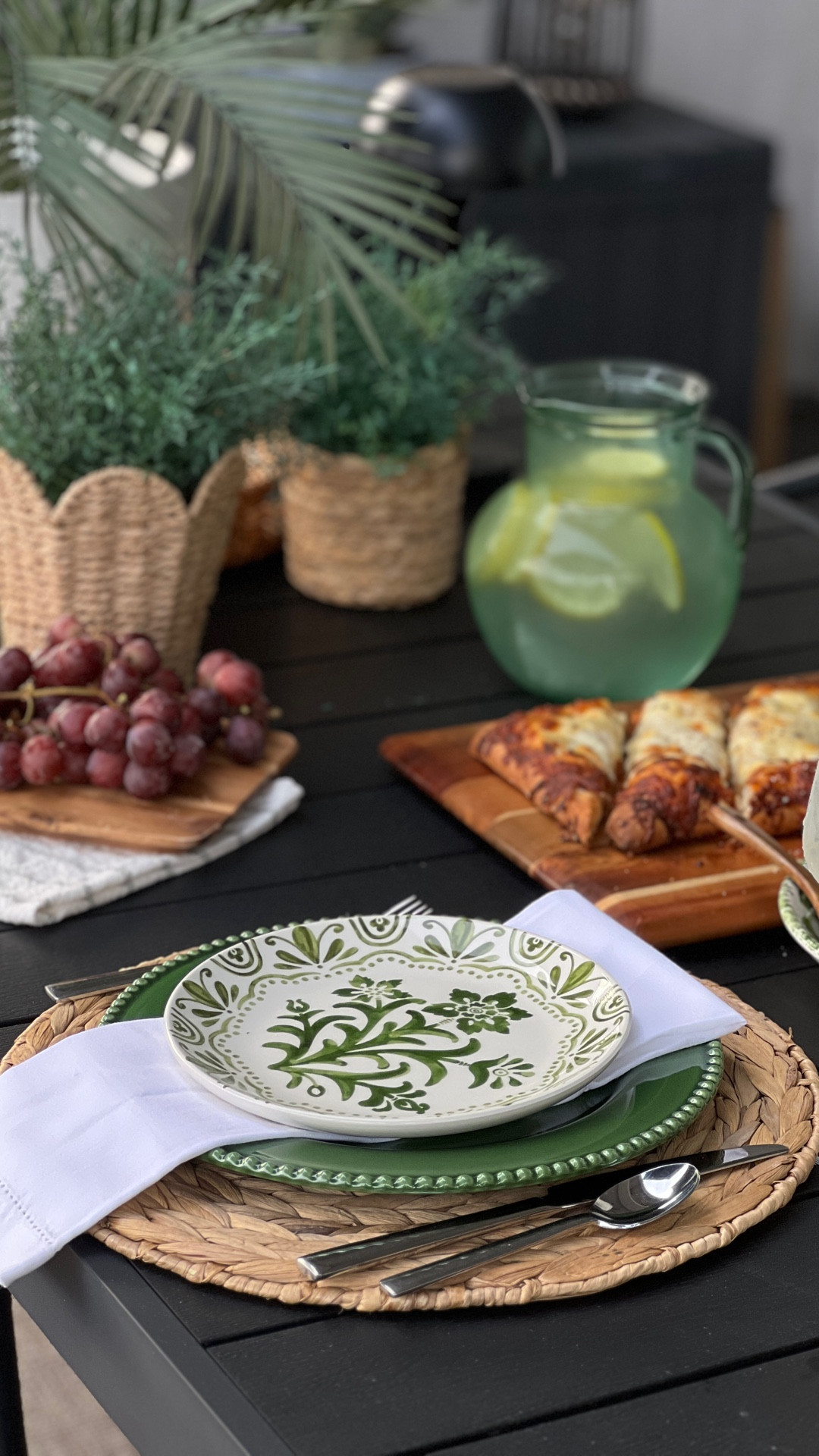 relaxed alfresco tablescape for outdoor dining featuring layered green and white dinnerware, woven placemats, crisp linen napkins, fresh greenery, and simple lemon water for a look that feels fresh, inviting, and effortlessly elevated for everyday gatherings; alfresco dining, outdoor dining, outdoor tablescape, eating outdoors, backyard entertaining, outdoor table setting, green and white table decor, layered table setting, woven placemats, linen napkins, fresh greenery, simple hosting ideas, outdoor brunch ideas, patio dining, entertaining at home, modern hostess, outdoor hosting ideas

#LTKSeasonal #LTKfoodie #LTKHome