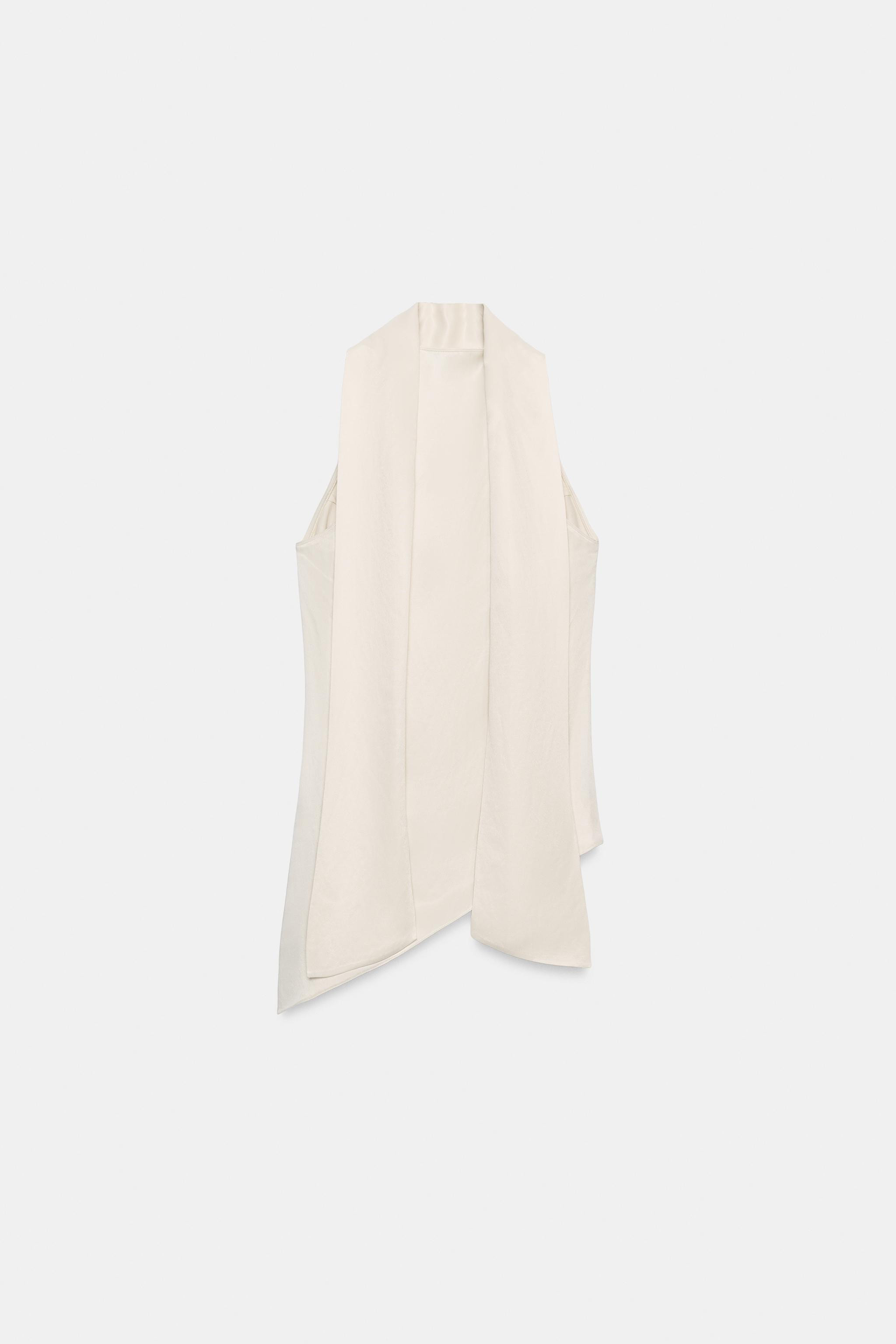 ZARA WOMAN COLLECTION  Top made from a viscose blend yarn. Halter neck with matching fabric tie d... | Zara US