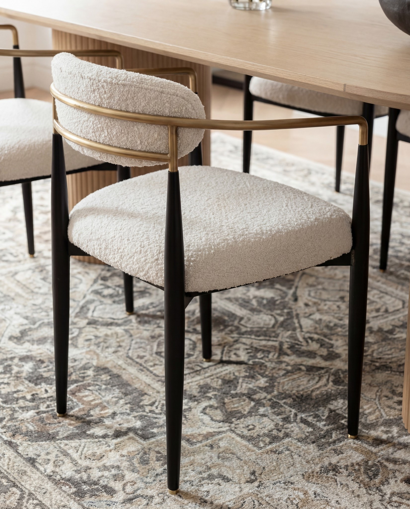 ✨ Shop the look:
Light oak oval dining table | Ivory boucle dining chairs | Brass and glass ribbed pendants | Vintage taupe and ivory rug | Blonde wood sideboard | Matte black vase | Neutral floral arrangement | Gold-framed wall art | Black metal window frames | Ceramic decor accents 

#LTKHome #LTKFindsUnder100 #LTKSaleAlert