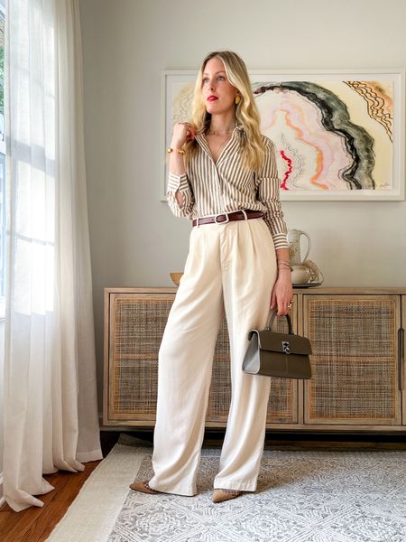 A look so good, you’ll want to go to the office. 👩‍💼 

Top: Sezane (size up)
Belt: Dehanche (LIZTEICH for 10% off on their own site)
Pants: Reformation (comes in petites, extended and tall!) 
Shoes: Manolo Blahnik
Bag: Cafuné
Lip: Tower28
Jewels: Christina Caruso



#LTKOver40 #LTKShoeCrush #LTKWorkwear