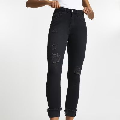 Black ripped mid rise skinny jeans | River Island (UK & IE)