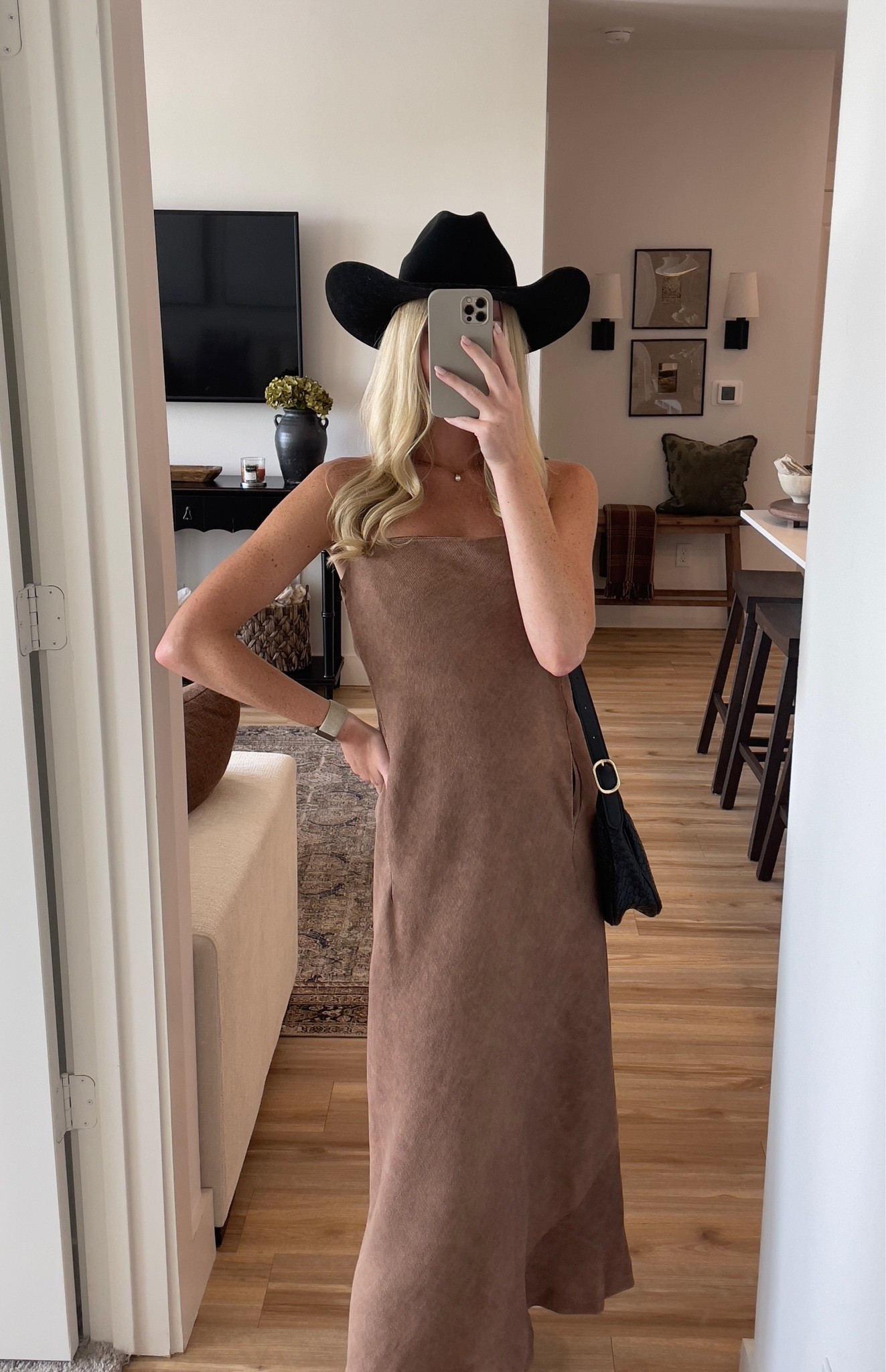 Gameday look! Western-inspired brown maxi dress paired with a black cowboy hat and simple black accessories.

western outfit / brown maxi dress / cowboy hat outfit / western style / country concert outfit / neutral dress / rodeo outfit / Nashville outfit / western fashion

#LTKU #LTKootd #LTKSeasonal