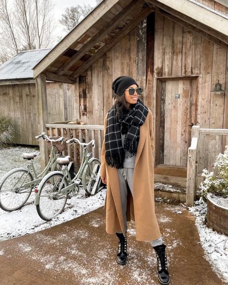 Kat Jamieson wears a camel coat, beanie and windowpane black scarf in the winter. Winter outfit, snow boots, jogger set. 

#LTKtravel #LTKshoecrush #LTKSeasonal
