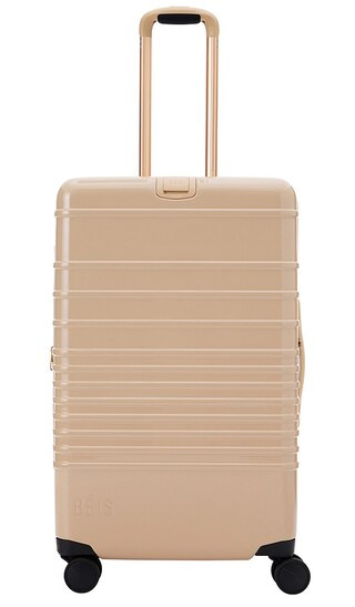 The Glossy Medium Check-In Roller in Beige | Revolve Clothing (Global)