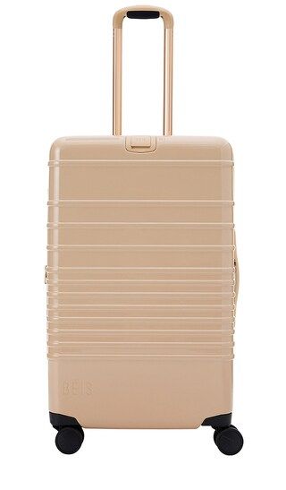 The Glossy Medium Check-In Roller in Beige | Revolve Clothing (Global)