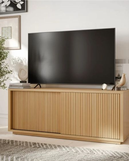 Back in Stock and the price is so good!! Love this gorgeous sideboard / media console with the beautiful fluted detail on the door and even more that it comes in natural and black!! 

#LTKhome #LTKstyletip #LTKsalealert