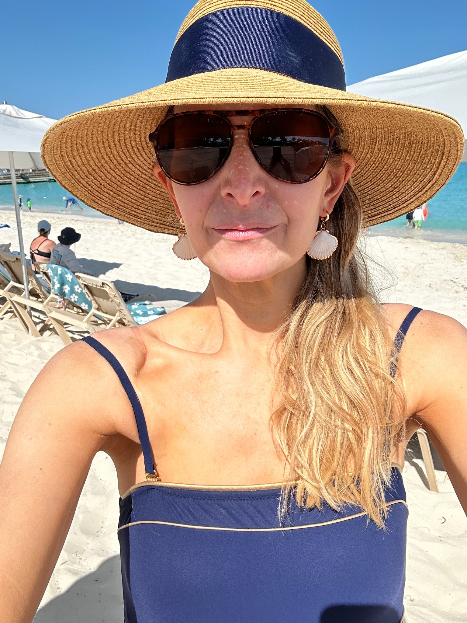 Love a navy swimsuit! This one has good coverage and I absolutely love this hat with a bow on the black. It’s packable, too. I folded it in two in my suitcase. 

#LTKSeasonal #LTKSwim #LTKTravel