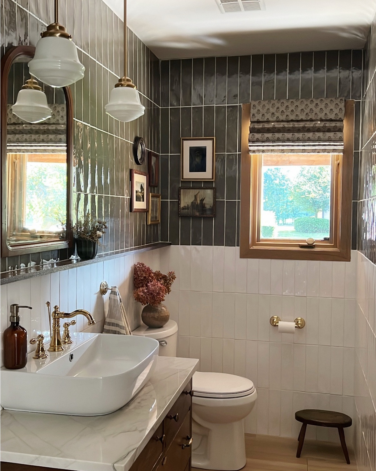 The evolution of our half bathroom 🤩 did you know you can tile over existing tile? There was so much tile already on the walls that when we started talking about renovating this space, my FIL (who is a tile setter by trade) recommended we just go right over it. It saved us A LOT of demo and mess and as long as your existing tile is in good condition, you shouldn’t have any issues. And I’m here to tell you that 7 years later it’s held up great 🙌🏻 

Last year we gave this room a refresh to repair the vanity and faucet and bring the whole space up to date with my evolving style. 

Over the years I’ve shifted from a more clean modern look, to a layered vintage style - paying closer attention to details and infusing lots of character. We are always changing and evolving and our homes should be a reflection of that. 

#LTKFamily #LTKHome