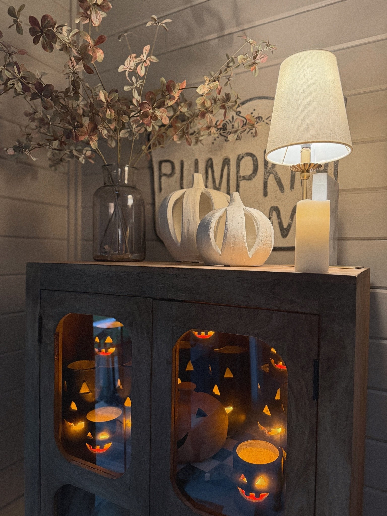 About as Halloween as I get 🤣🎃🤎 cozy!!! These Jack-o-lantern candle holders are super old sadly but I linked the fun lights in them! Florals are also old & cabinet as well from Kirklands years ago! 🍂

Home decor / cozy / @Target / @antiquefarmhouse / Holley Gabrielle