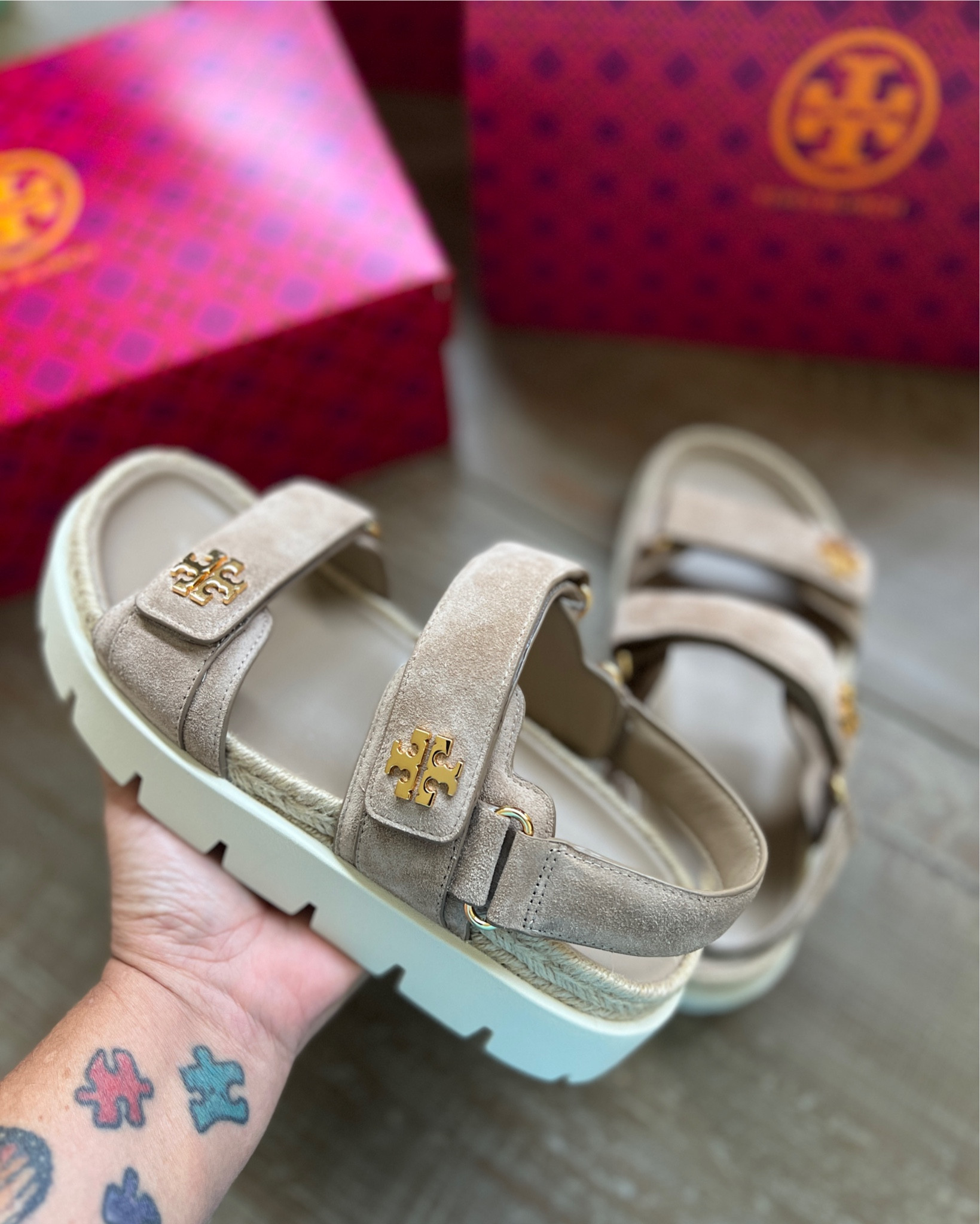 Tory Burch - Day-to-evening wearability combines a practical silhouette with elevated details. Our Kira Rope Sport sandal offers a textured take on summer elegance with mixed materials, pairing suede straps with a jute-lined midsole. The ultra-comfortable molded leather footbed is set on a sawtooth rubber sole and utilitarian velcro straps are detailed with our signature logo. 

#LTKShoeCrush #LTKMidsize #LTKOver40