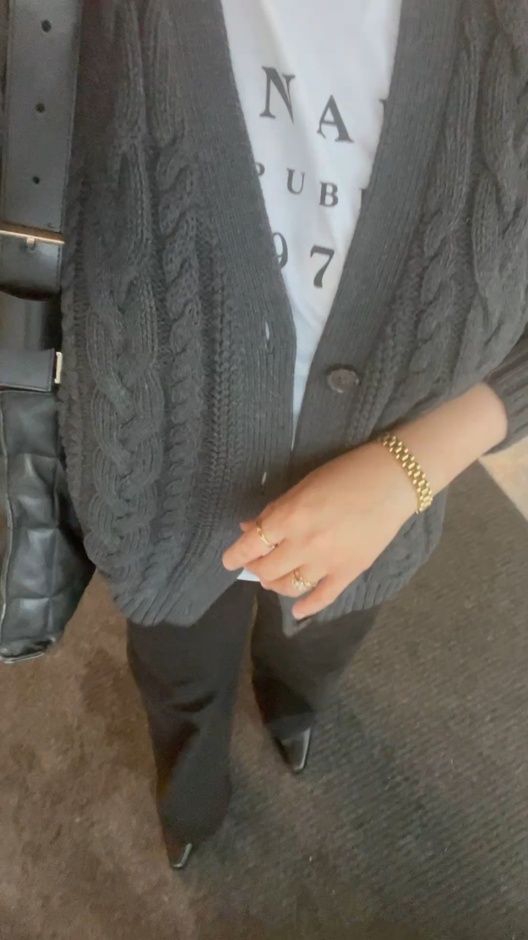 Here’s a great Fall outfit perfect for cold offices!

Cable knit cardigan, graphic tee to keep it casual, black jeans, black Chelsea boots, pops of gold jewelry.

#LTKootd #LTKWorkwear #LTKOver40