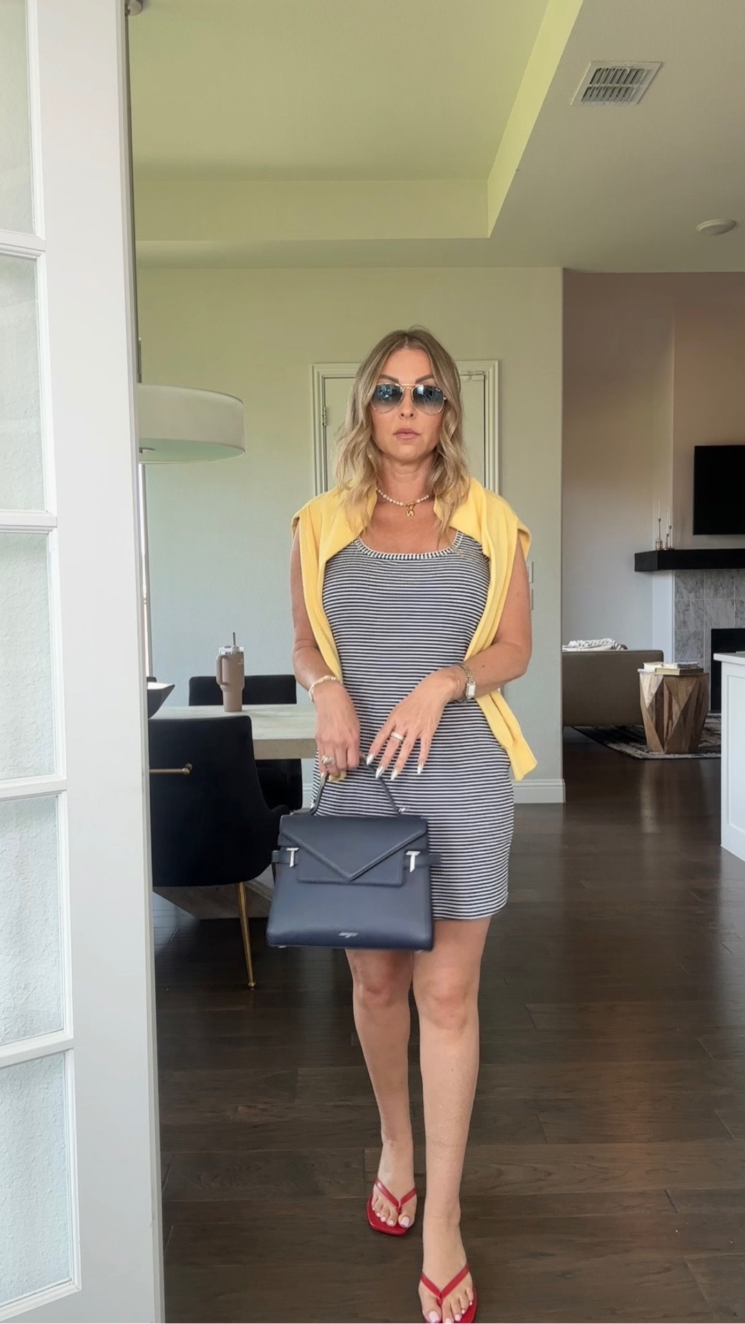 An easy summer look inspired with simple pieces styled intentionally 🤍 

The striped dress keeps things effortless, the yellow sweater softens the look, and the red heels add just enough contrast to make the outfit feel elevated without trying too hard. Exactly the kind of polished real-life outfit I love wearing all summer long. 

#over40style #highlowstyle #summerstyle #memorialdaystyle #ltkfashion

#LTKgrwm #LTKootd #LTKSeasonal