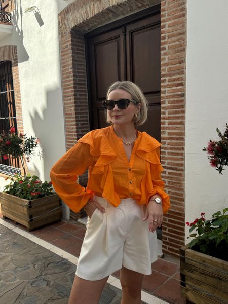 Summer holiday outfit idea - orange frill blouse & cream tailored shorts from Laura Byrnes x Very edit, mantra tortoiseshell sunglasses  

#LTKstyletip #LTKeurope #LTKSeasonal