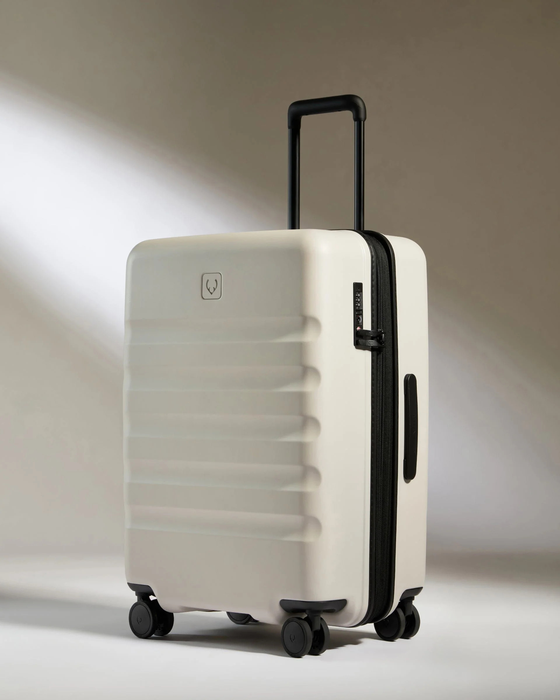 Medium suitcase in Taupe - Icon Stripe | Lightweight & Hard Shell Suitcase | Antler UK