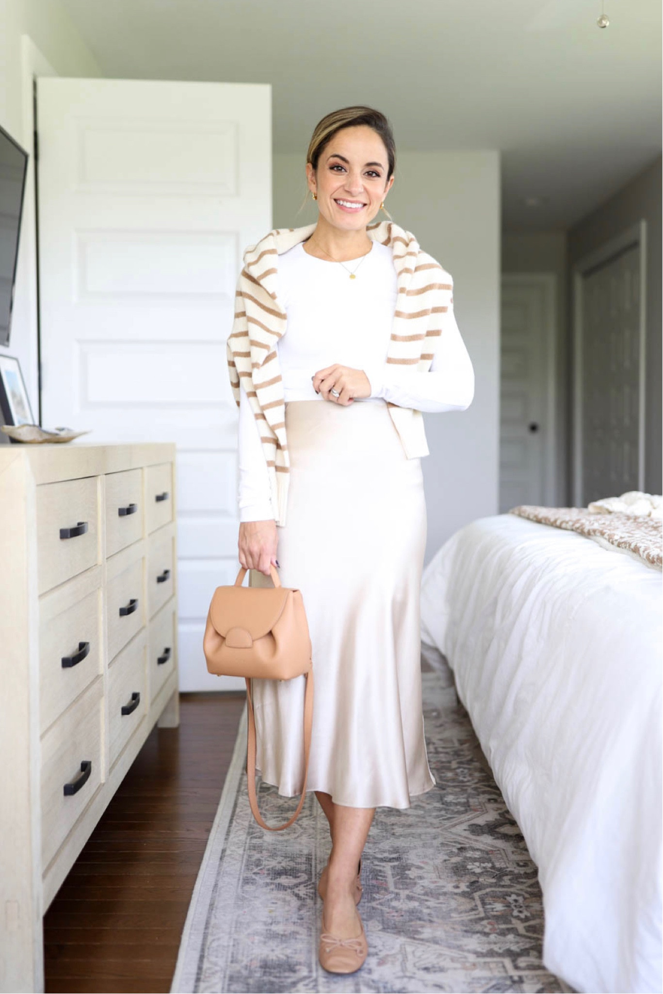 Capsule series: five ways to wear a silk skirt 

Skirt: xs in champagne 
Top: similar option linked (top from Abercrombie) 
Sweater: xxs 
Flats: tts 
Bag: polene un nano in textured tan 

#LTKworkwear #LTKSeasonal #LTKstyletip