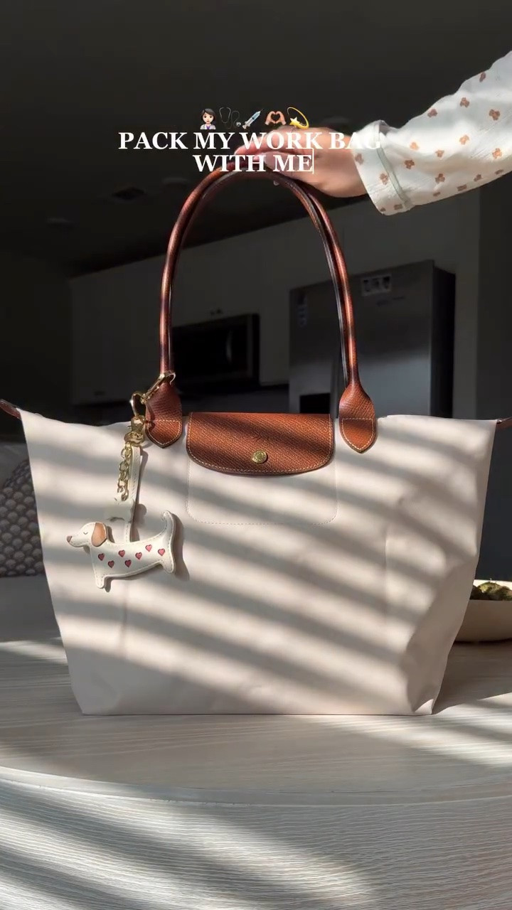 I’m just a girl (in healthcare) 👩🏻‍⚕️🩺💉🫶🏼💫
Bag charm is from @markandgraham 
Bag is @longchamp le pliage in large 
•
•
•
#packmyworkbag #workbag #asmrpacking #longchamp #asmrsounds 
Pack my work bag with me, work bag, pack my bag, pack with me, asmr packing, asmr sounds, longchamp, longchamp le pliage, satisfying, aesthetic